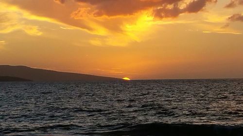 Scenic view of sea at sunset