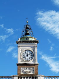 Low angle view of clock tower against sky