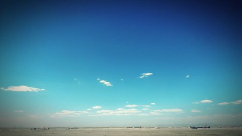 Scenic view of sea against blue sky