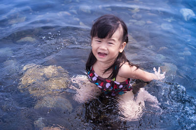 Portrait of girl swimming lake
