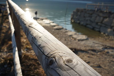 Close-up of wooden posts on beach