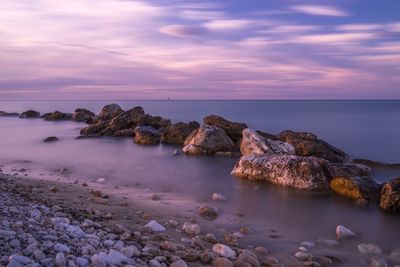 Scenic view of sea against sky at sunset