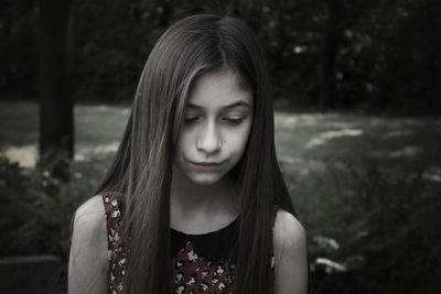 Close-up of young woman looking down