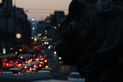 Close-up of illuminated city against sky at night