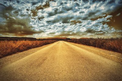 Scenic view of landscape against cloudy sky