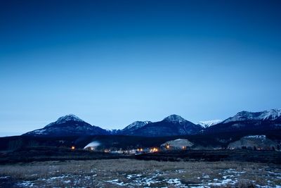 Illuminated lights on field against clear sky at banff national park