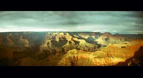 Scenic view of mountains against cloudy sky