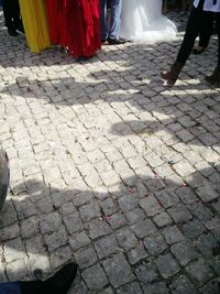 Low section of woman walking on street