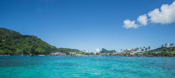 Scenic view of sea against blue sky