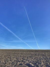 Low angle view of vapor trails in sky