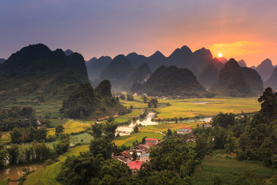 Scenic view of landscape against sky during sunset