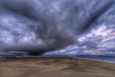 Scenic view of dramatic sky over beach