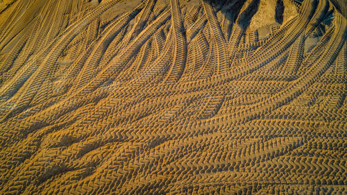 Full frame shot of sand on sunny day