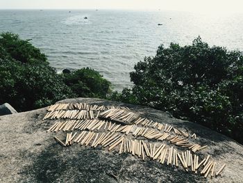 High angle view of rocks by sea