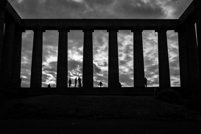 Low angle view of silhouette building against sky