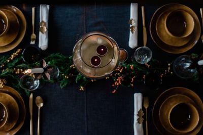 Tea light candles in a candle holder on a decorated dinner table