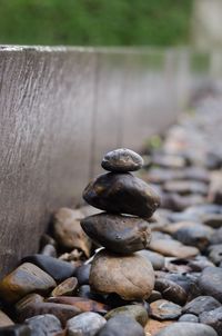 Close-up of stones stacked on land
