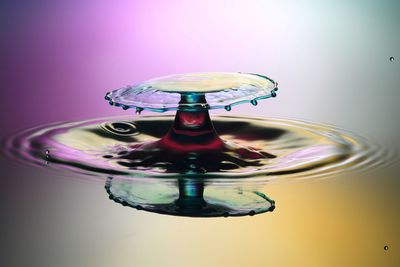 Close-up of water drop against blue background