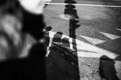 Shadow of people on road