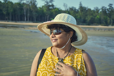 A casual looking indian tourist girl at shankarpur sea beach, in west bengal.