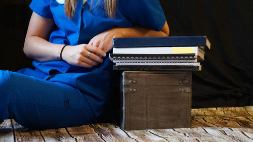 Low section of woman sitting on laptop