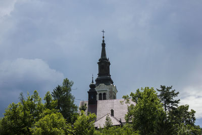 Low angle view of statue against sky