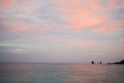 Scenic view of sea against sky at sunset