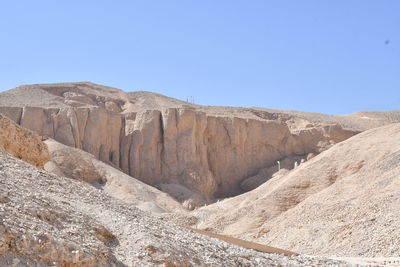 Scenic view of mountains against clear blue sky