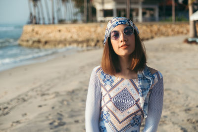 Close-up of woman standing on beach