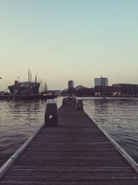 Boats moored at harbor