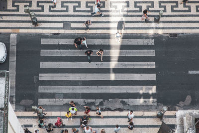 High angle view of people crossing city street