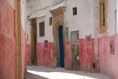 Empty alley amidst buildings in city