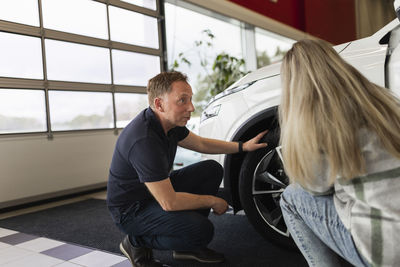 Woman in car dealership office