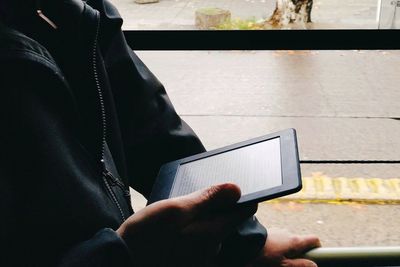 Close-up of man using mobile phone