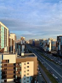 High angle view of buildings in city against sky