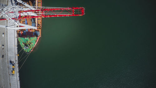 Scenic view of ship with cranes