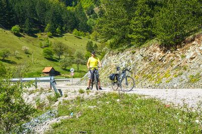 People riding bicycle on plants