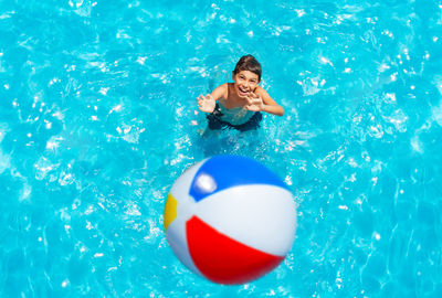 High angle view of teenager boy in swimming pool