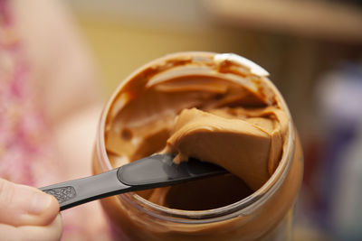 Close-up of hand holding ice cream