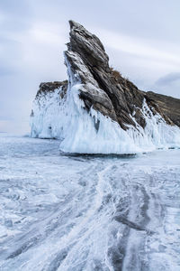 Scenic view of frozen sea against sky during winter