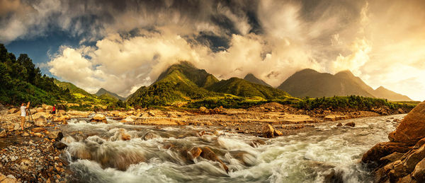 Panoramic view of sea and rocks against sky