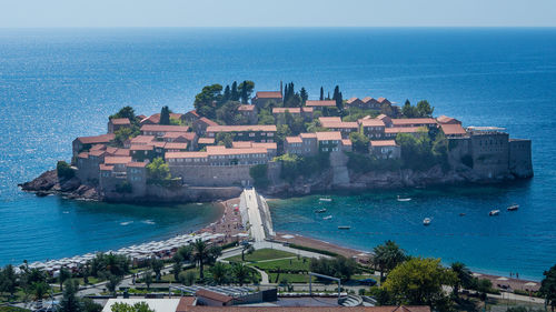 View of sea with buildings in background