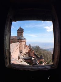 View of cityscape seen through window