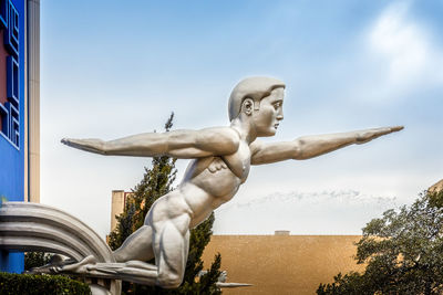 Low angle view of statue against sky