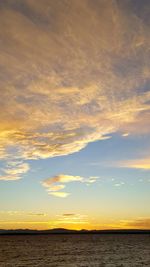 Scenic view of sea against sky at sunset