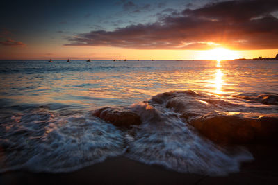 Scenic view of sea against sky during sunset