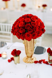 Close-up of red rose on table