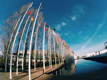 Low angle view of flags on riverbank