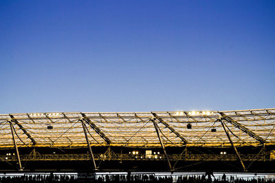 Low angle view of buildings against clear blue sky