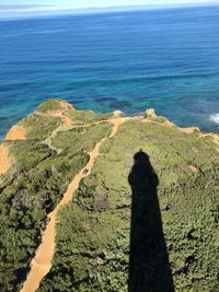 High angle view of shadow on beach against sky